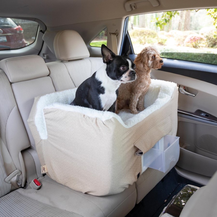 https://snoozerpetproducts.com/wp-content/uploads/2022/04/lifestyle-snoozer-pet-products-lookout-ii-dog-car-seat-storage-tray-birch-diamond-large-square.jpg